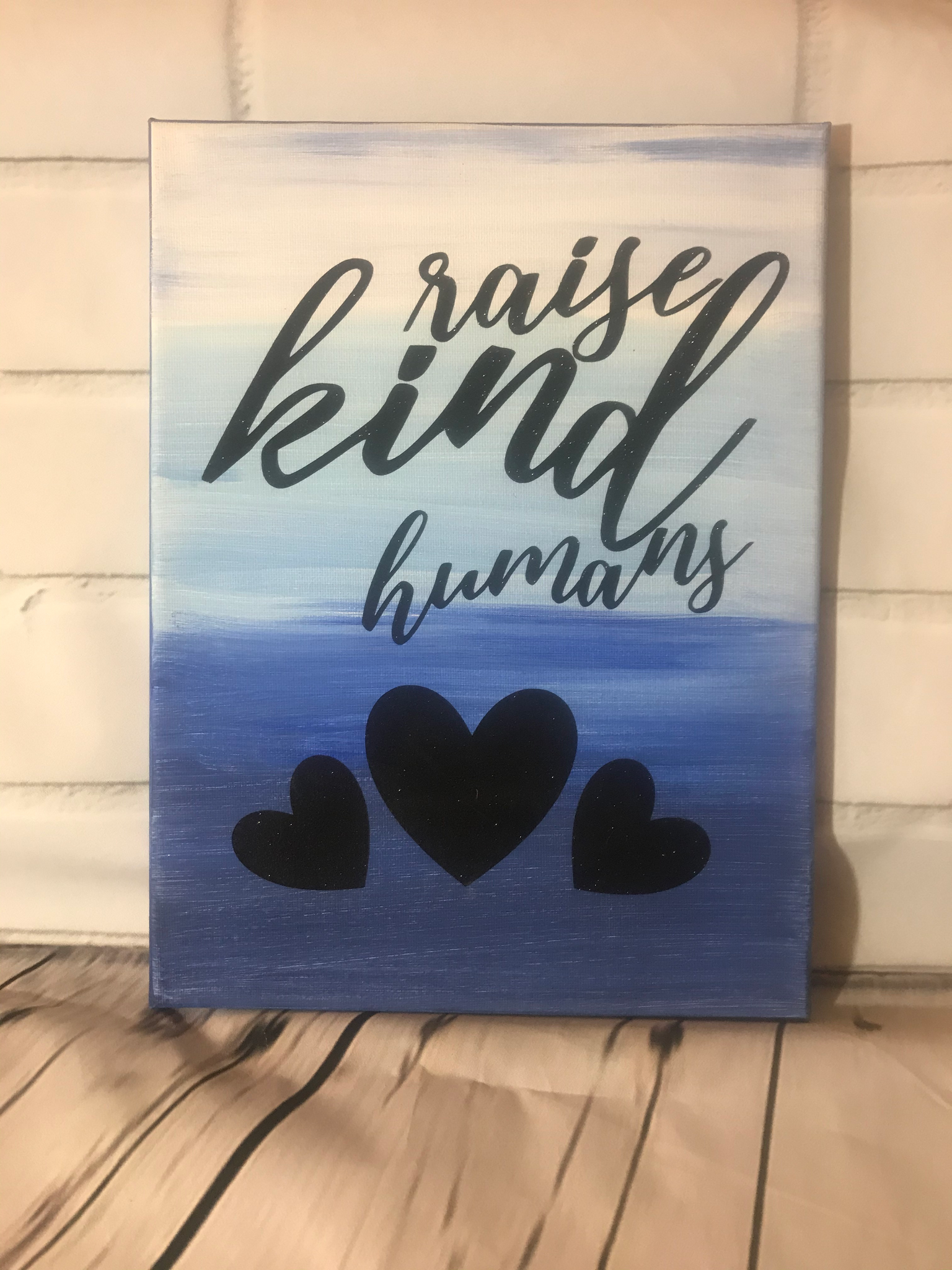 Raise Kind Humans wall hanging